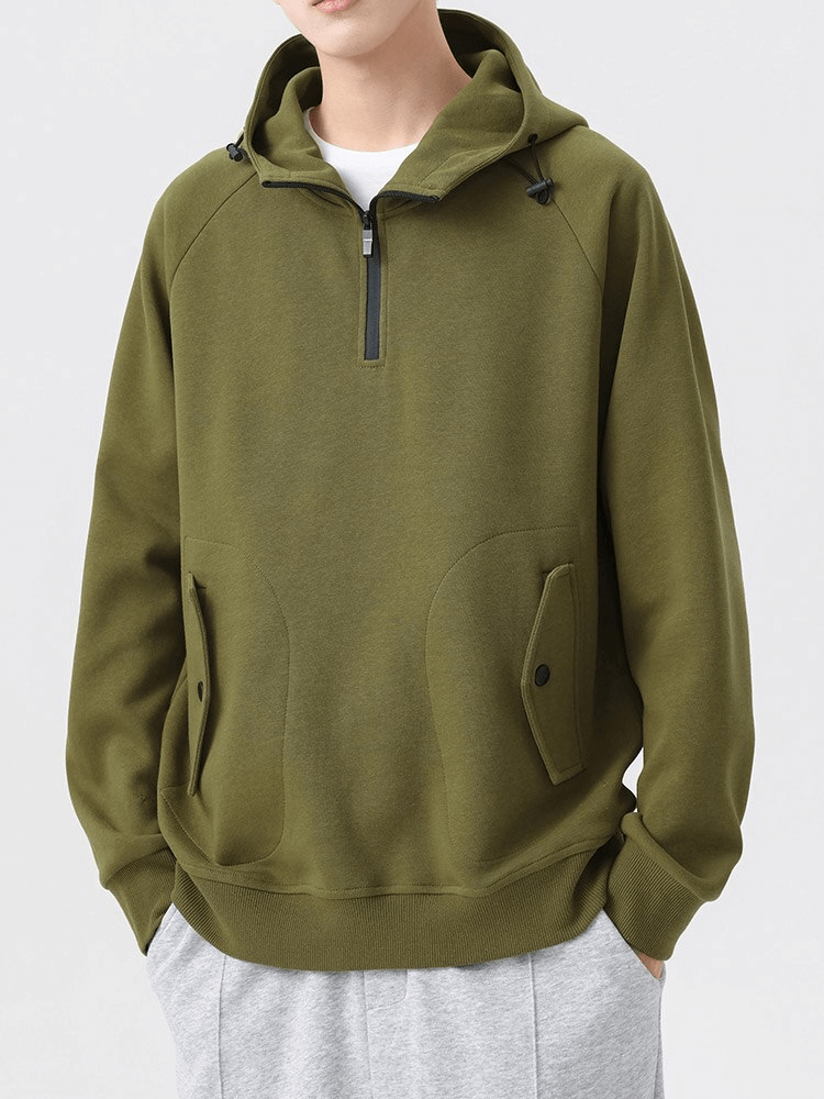 Men's green long sleeves half-zip hoodie with pockets, perfect for style and comfort.